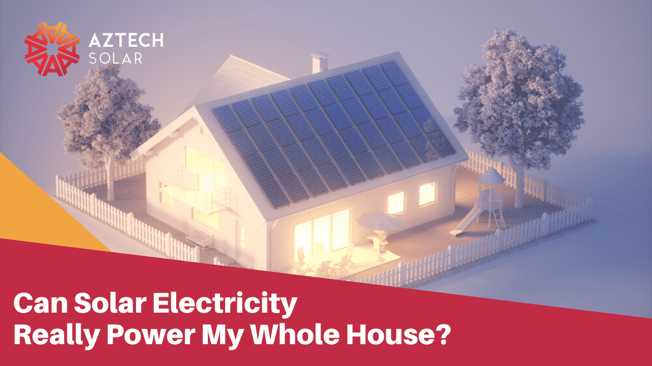 Home with rooftop solar panels and fenced yard