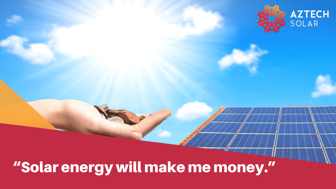 Hand holding coins beside solar panels in sunlight