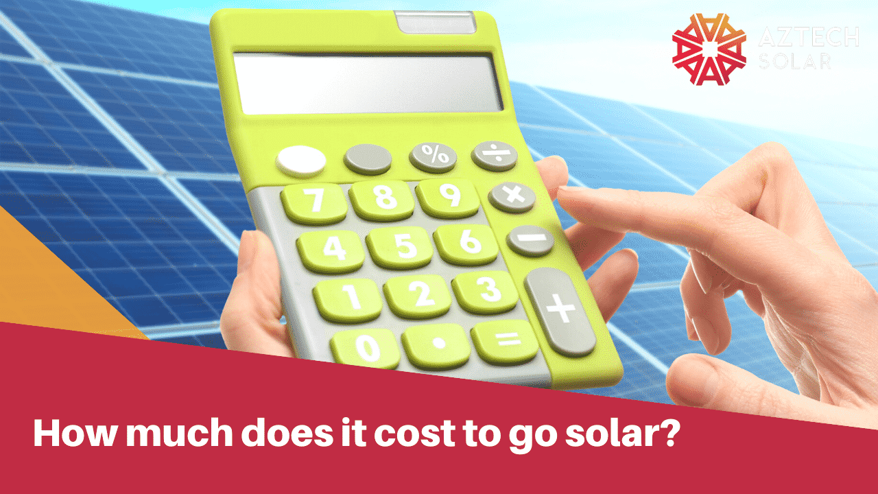 Calculator over solar panels estimating installation costs