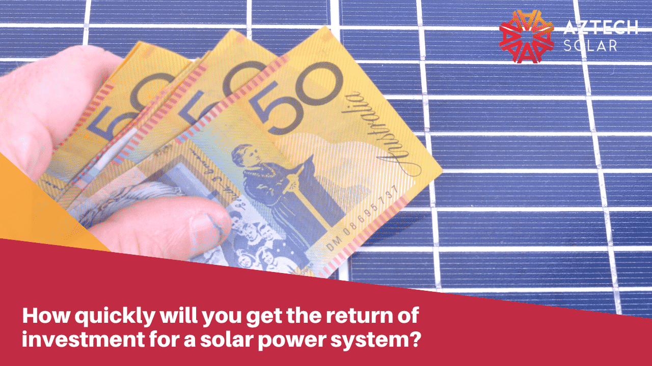 Hand holding Australian currency near solar panels.