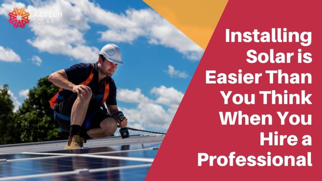 Person installing solar panels on a rooftop.
