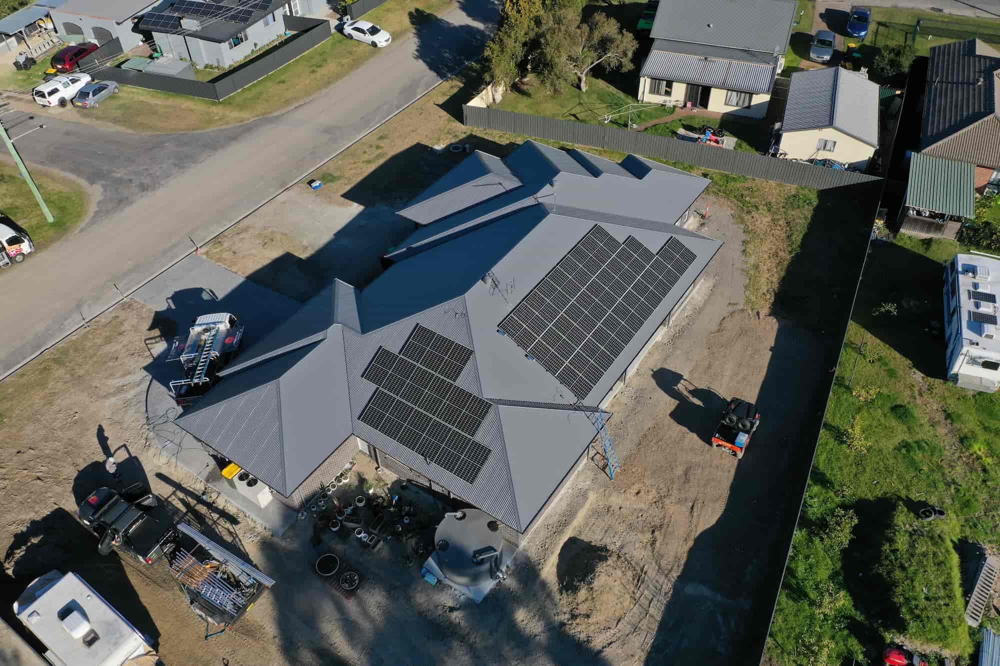 Aerial view of a house with solar panels