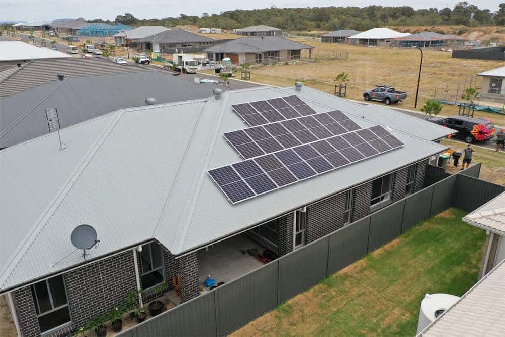 Solar panels on suburban home roof in estate