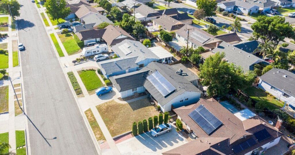 Aerial view of suburban houses and streets.
