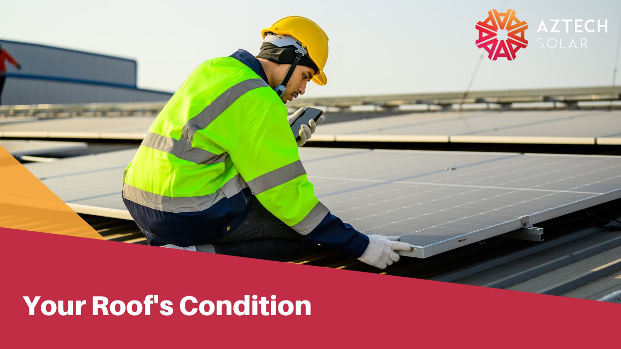 Professional man checking on roof solar panels