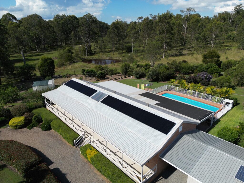 Aerial view of a house with a pool