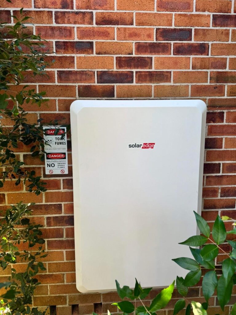 SolarEdge battery system on a brick wall