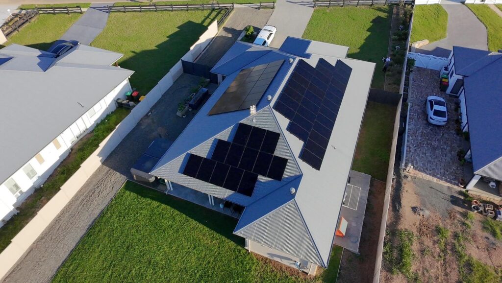 Aerial view of a house with solar panels