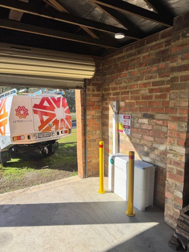 Entrance to a garage with solar equipment.