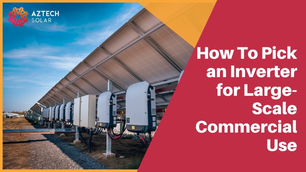 Commercial solar farm inverters beneath panel array